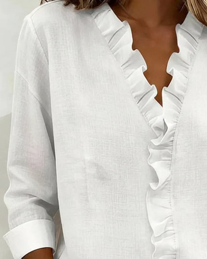 SARA | Blusa con scollo a V e volant delicati